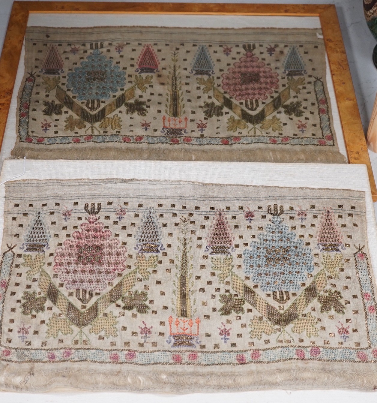 Two 19th century embroidered Turkish towel ends, one framed, 46cms wide x 30cms high